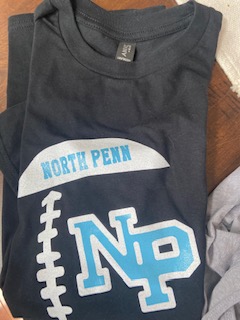 A black colored t-shirt with north penn Football logo